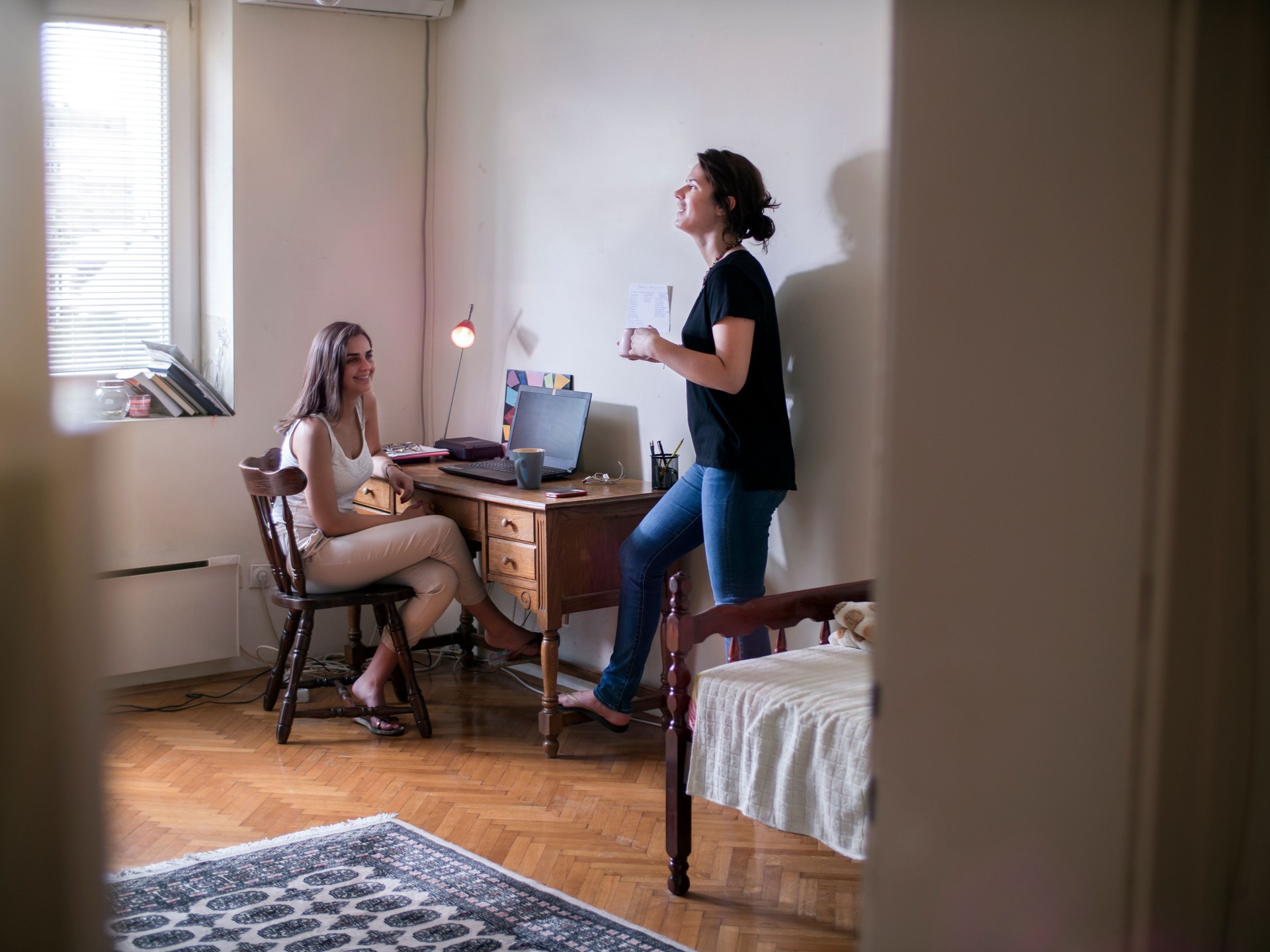 Roommates talking at campus apartment